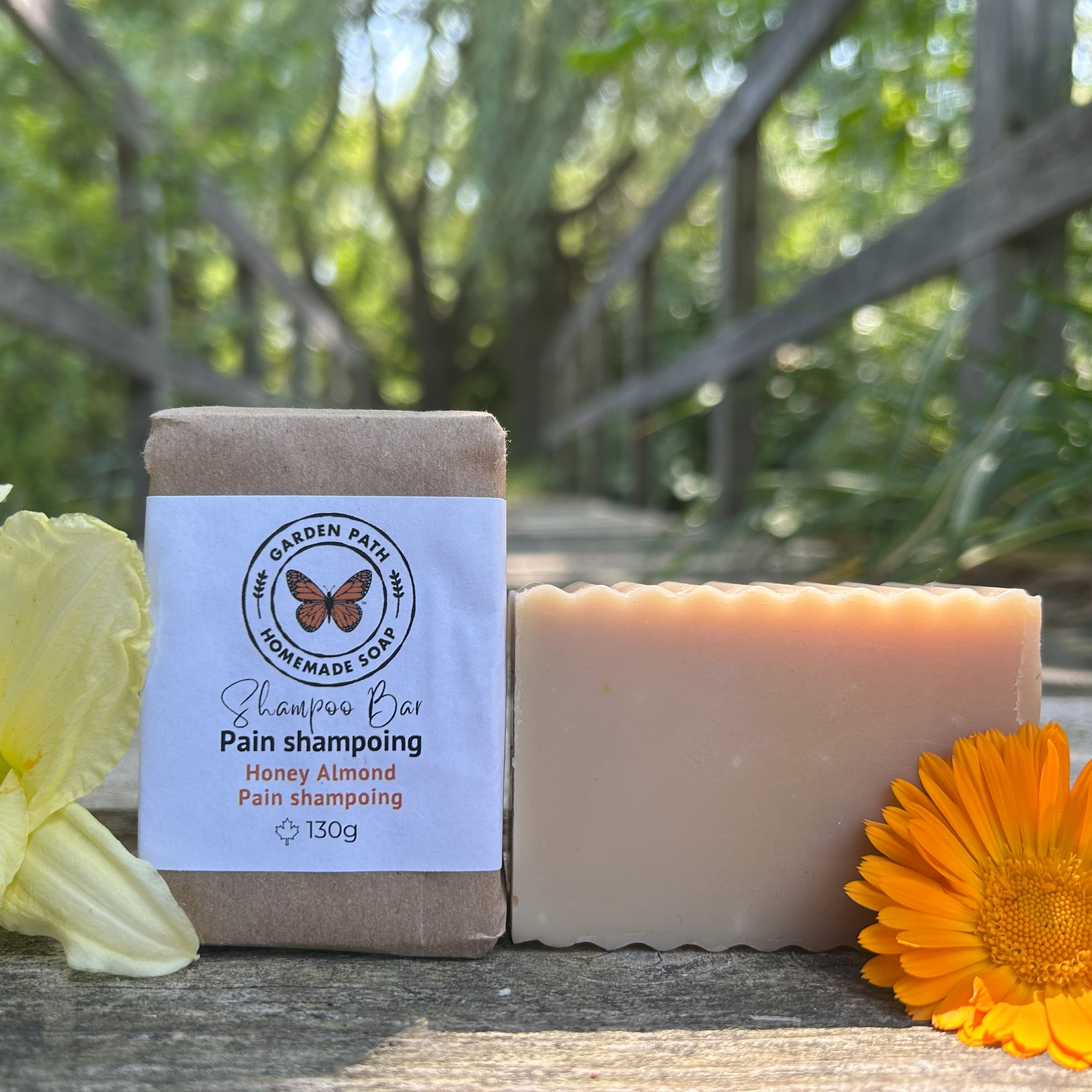 Large Honey Almond Shampoo Bar in an outdoor natural setting with yellow and orange flowers beside | Lightly Scented Honey Almond Fragrance | Made with Beer - Garden Path Homemade Soap