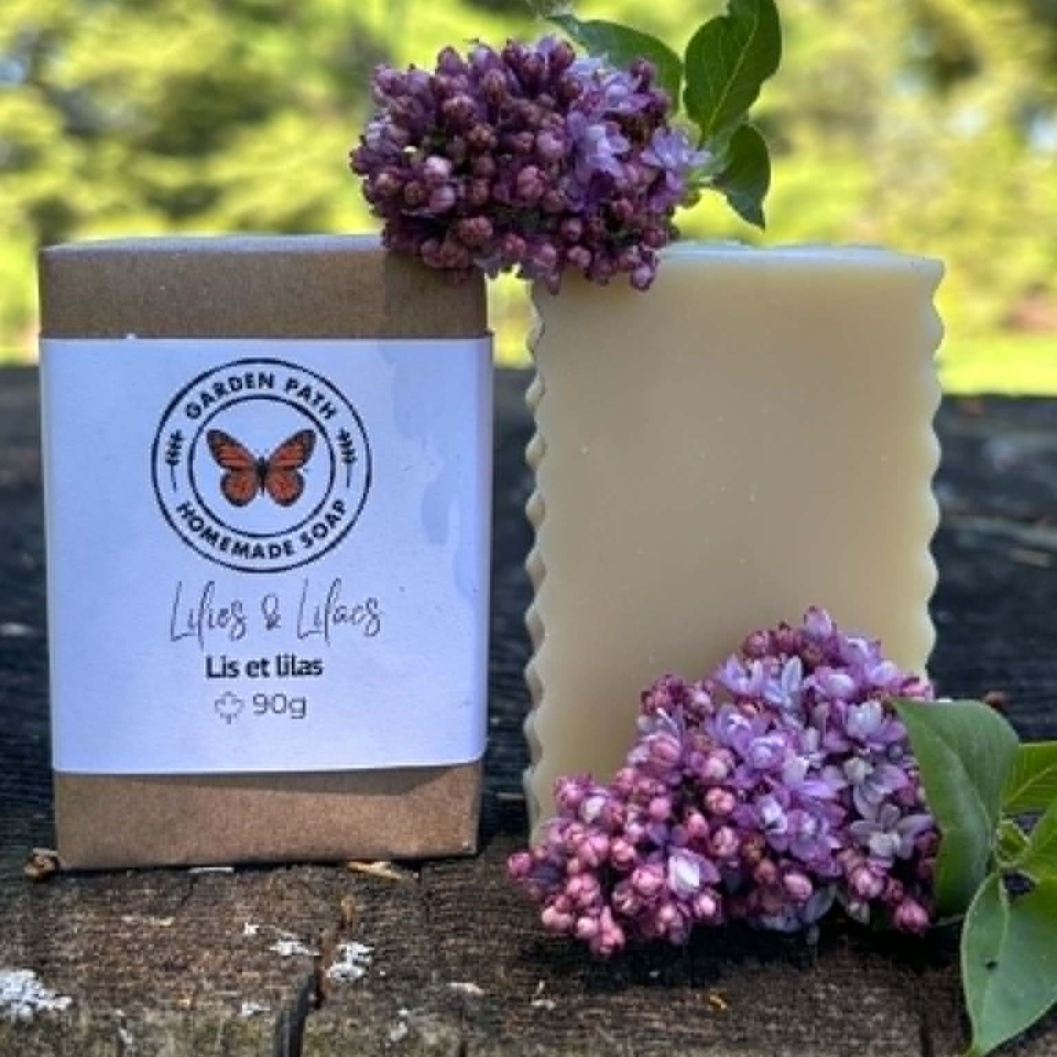 Lilies & Lilacs Bar Soap (limited time) both wrapped and unwrapped with purple lilac flowers beside the soap | Lightly Scented Floral - Garden Path Homemade Soap