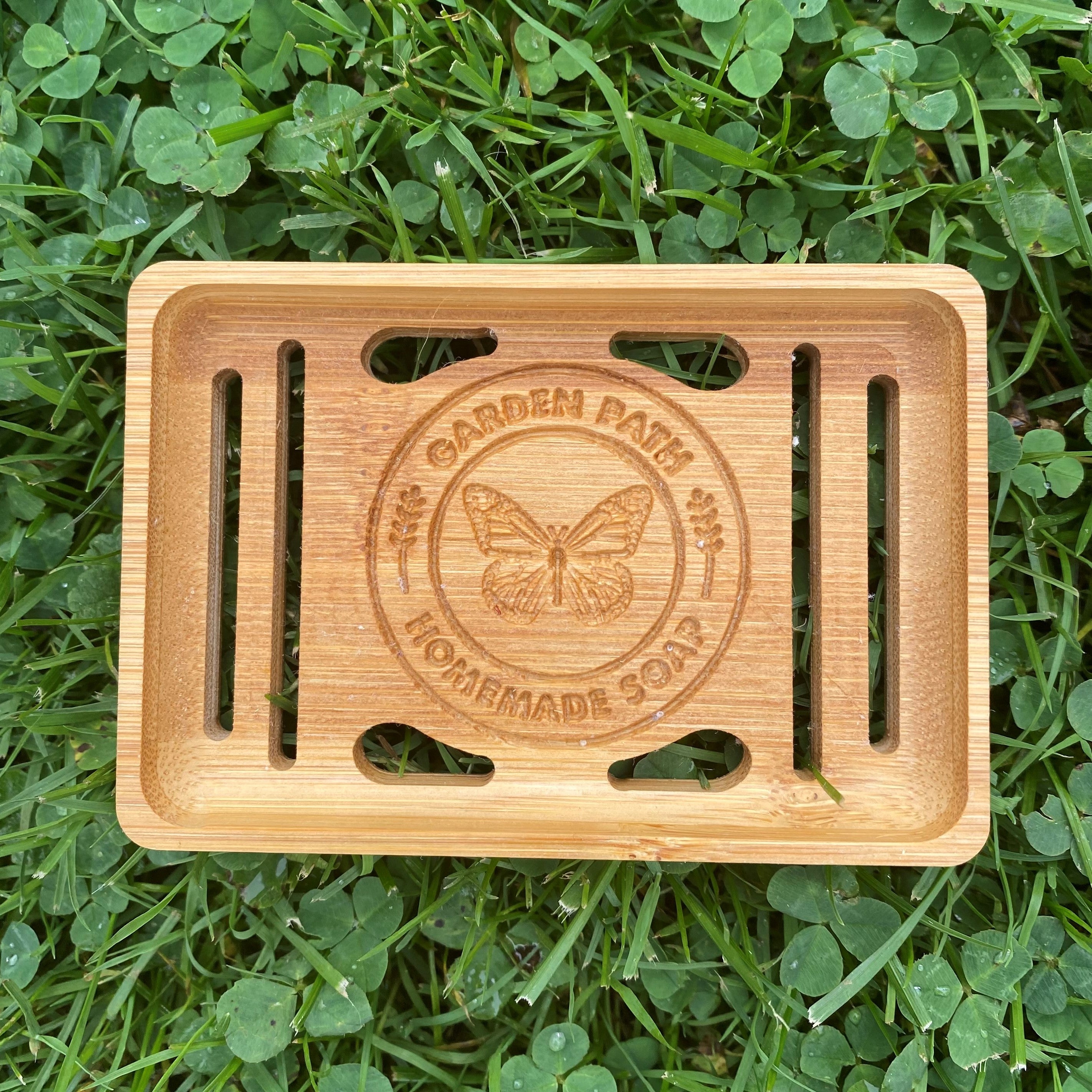 Single Bamboo Soap Dish with Garden Path Homemade Soap label in the bottom of one side. Slats in the bottom of the dish for drainage.