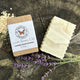 Lavender, Rosemary & Oats Bar Soap on a wooden surface with oatmeal flakes and lavender flowers | 100% Natural Exfoliating Soap with Essential Oils - Garden Path Homemade Soap