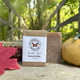 Pumpkin Spice Bar Soap (limited time)  on a wooden surface with yellow squash, maple leave and corn beside the bars.| Lightly Scented with Pumpkin Spice Fragrance - Garden Path Homemade Soap