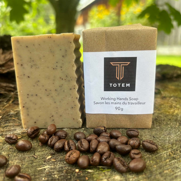 Working Hands Bar Soap wrapped and unwrapped with coffee beans scattered around- Garden Path Homemade Soap