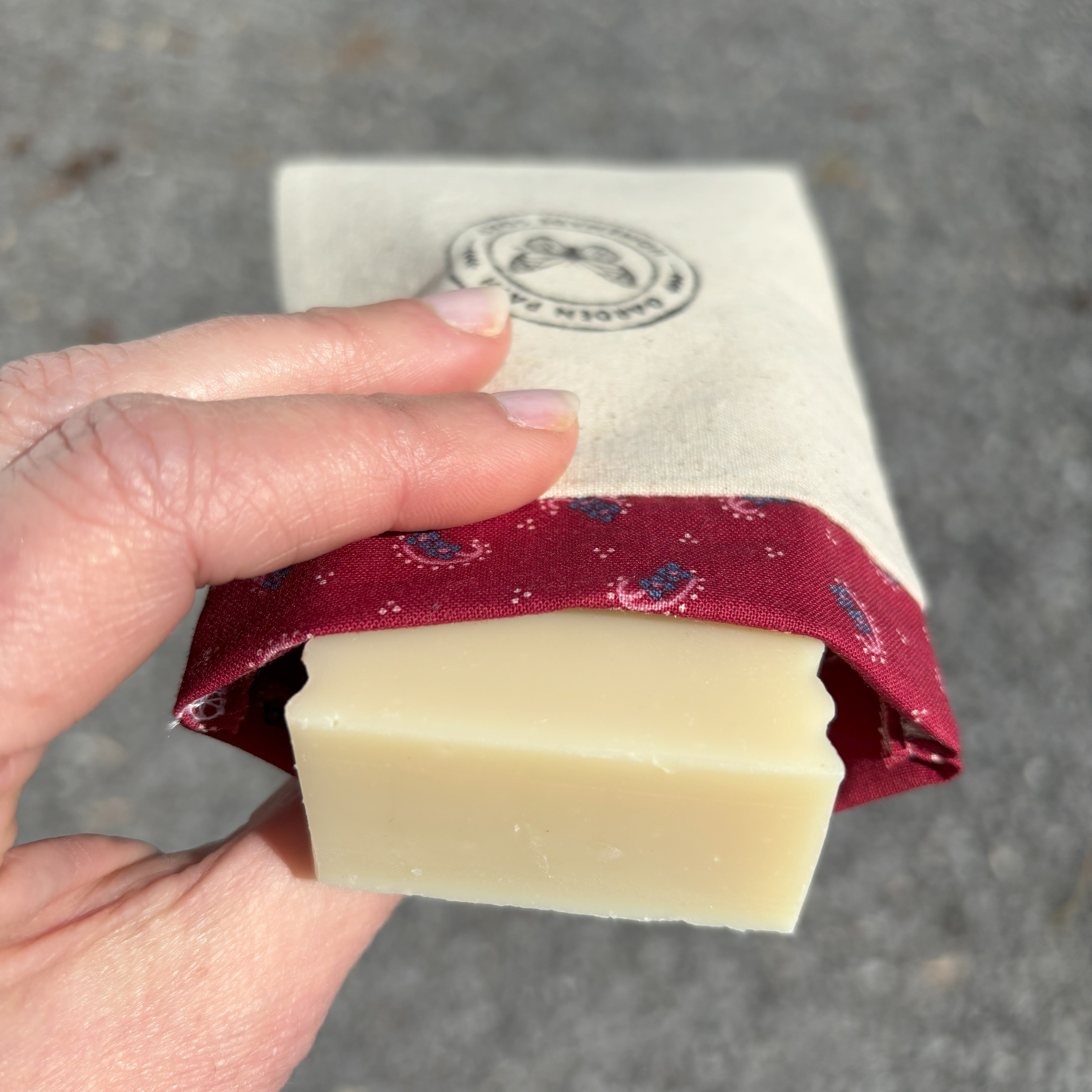 soap inside a soap travel bag with a person holding the bag
