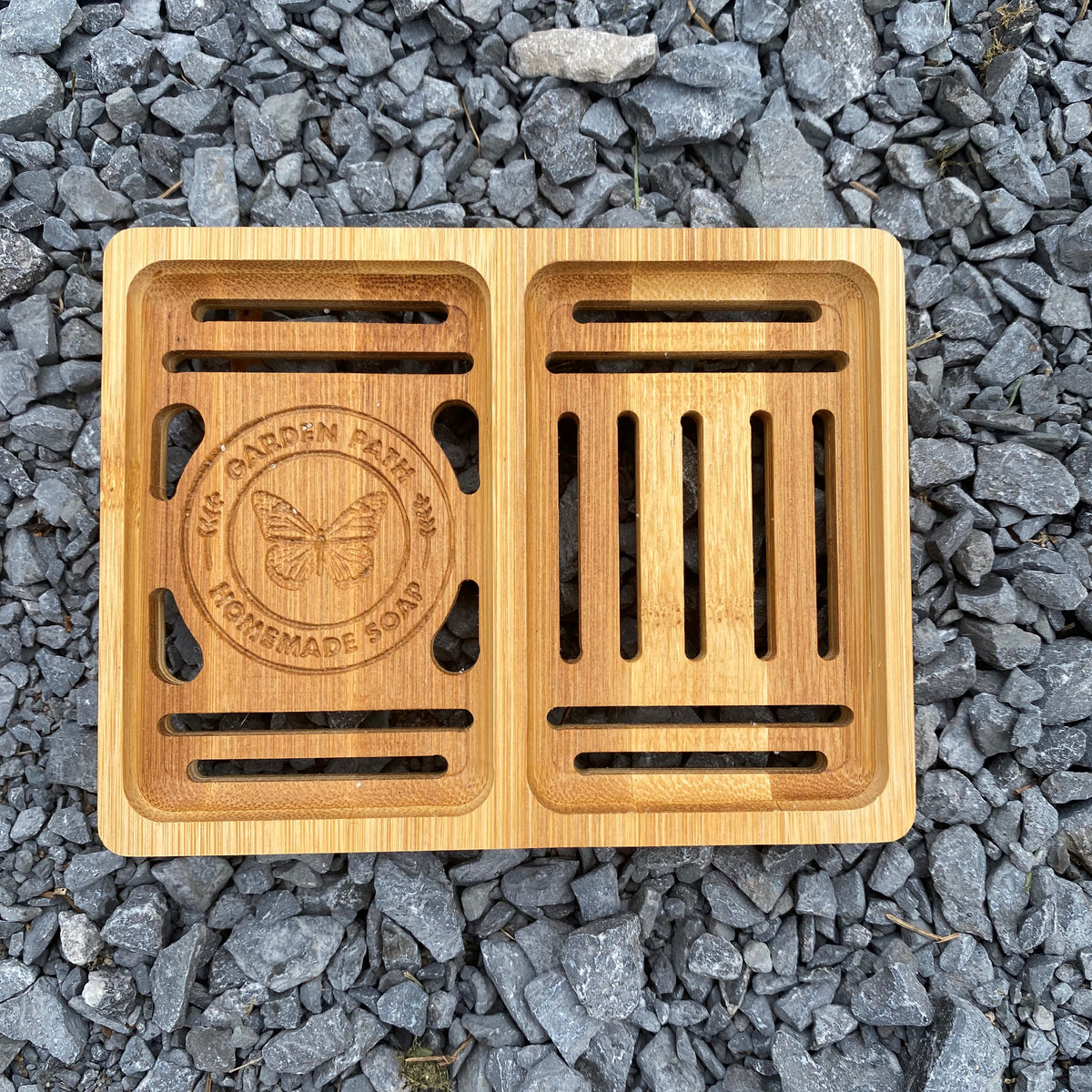 Bamboo Double Soap Dish with Garden Path Homemade Soap label in the bottom of one side. Slats in the bottom of the dish for drainage.