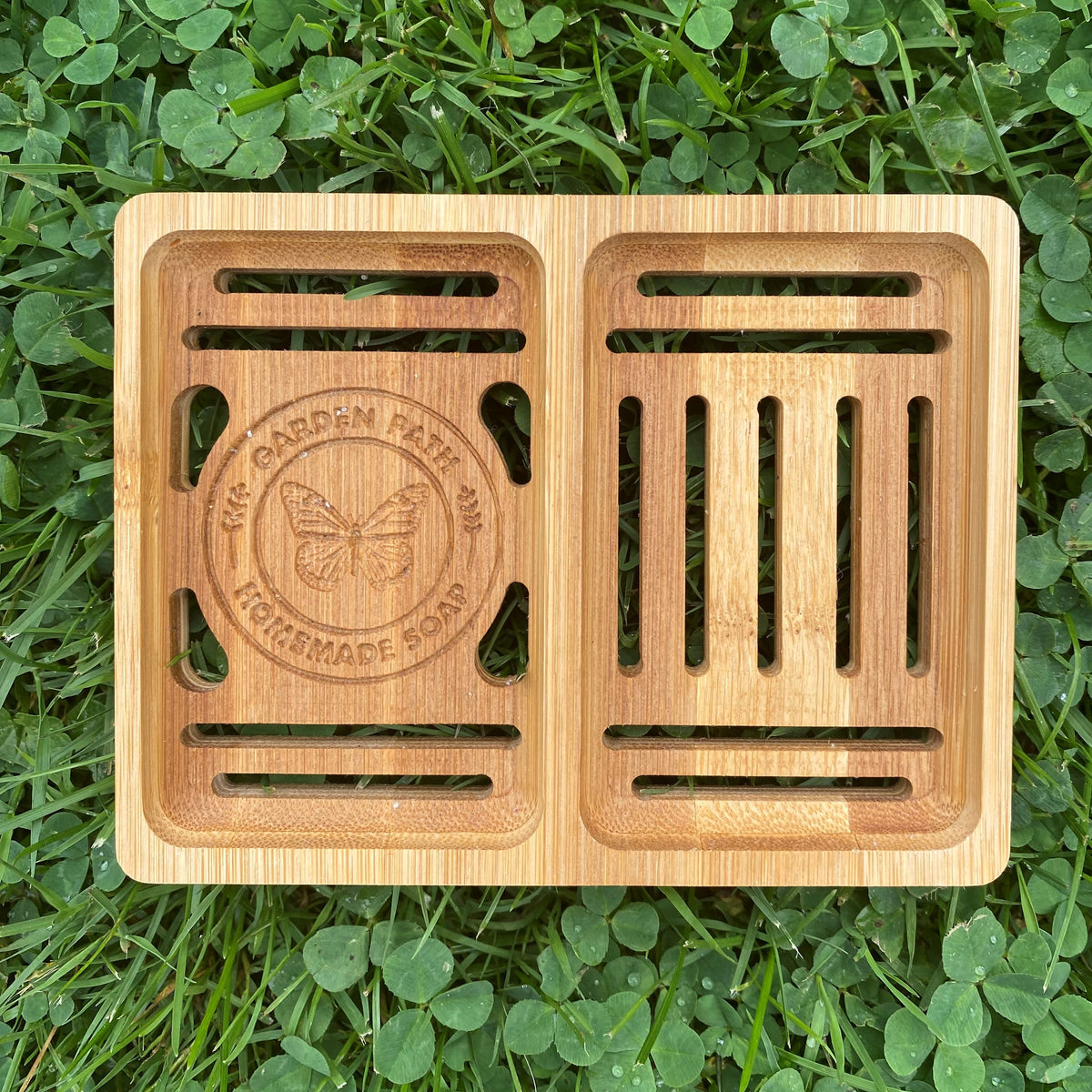 Bamboo Double Soap Dish with Garden Path Homemade Soap label in the bottom of one side. Slats in the bottom of the dish for drainage.