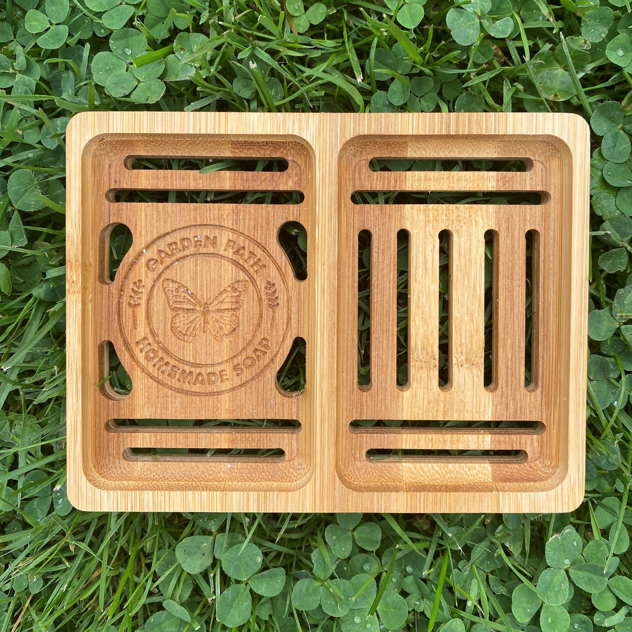 Bamboo Double Soap Dish with Garden Path Homemade Soap label in the bottom of one side. Slats in the bottom of the dish for drainage.