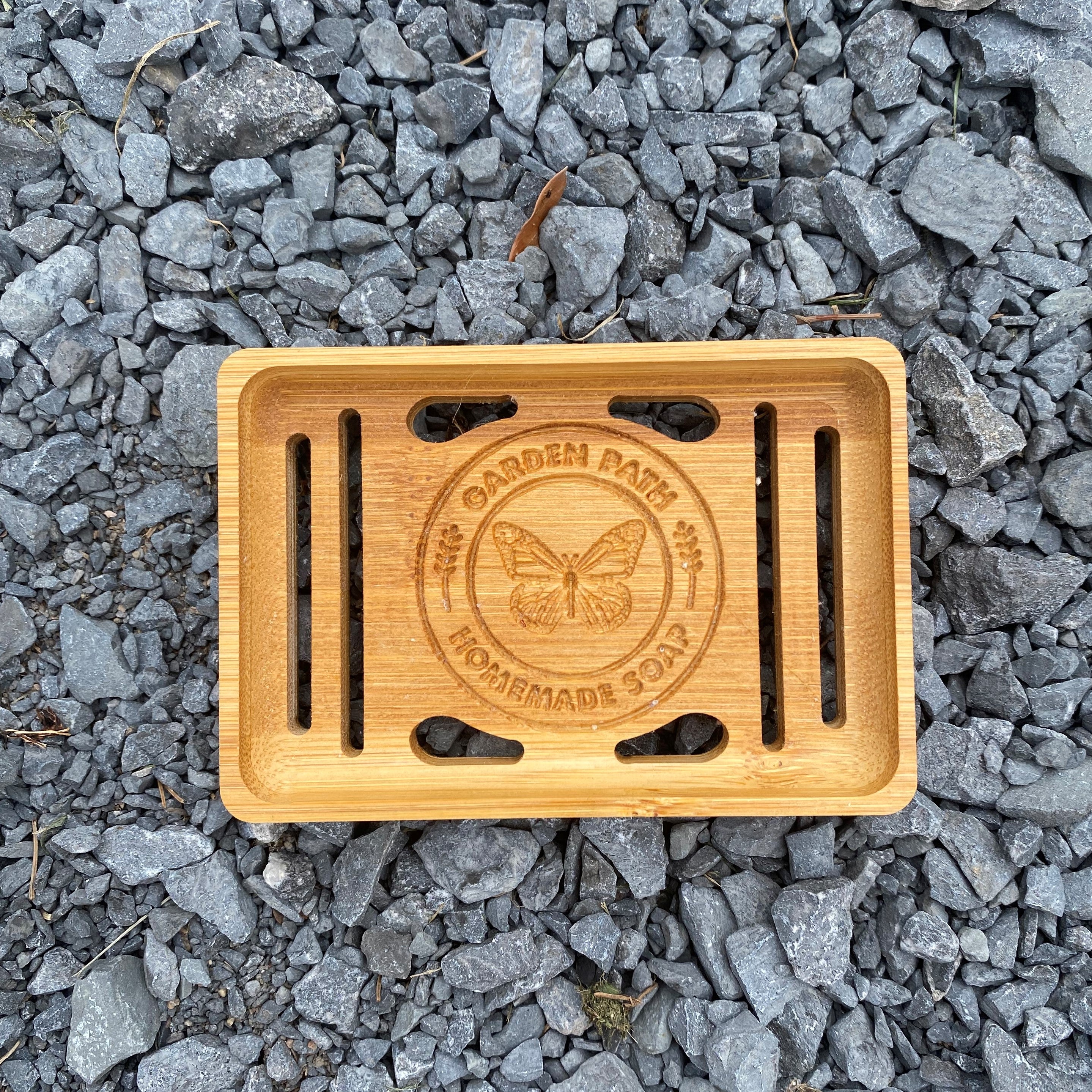 Single Bamboo Soap Dish  with Garden Path Homemade Soap label in the bottom of one side. Slats in the bottom of the dish for drainage.